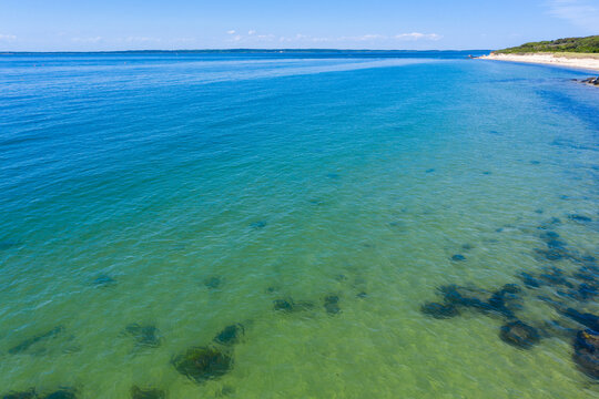 shore and sand meet to form paradise