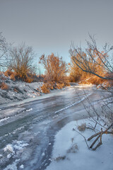 Beautiful frozen river during cold winter day.