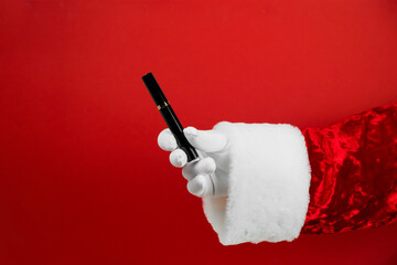 Santa hand with mascara for eyes. Womens cosmetics as a gift. Present for girl.