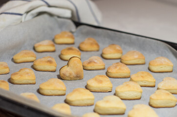 Homemade sweet cookies in the shape of hearts. Home comfort in the kitchen. Cooking with love