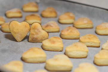 Homemade sweet cookies in the shape of hearts. Home comfort in the kitchen. Cooking with love