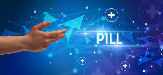 Close-Up of cropped hand pointing at PILL inscription, medical concept