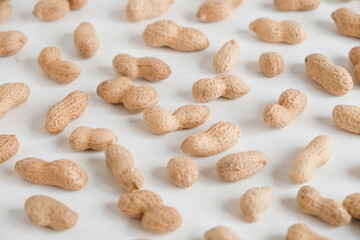 Peanuts in shell on a white background. Top view. Copy, empty space for text
