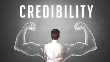 Rear view of a businessman with CREDIBILITY inscription, powerfull business concept