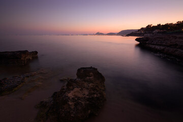 Coastal, sunset, long exposure landscape. Purple and red lights. Alicante harbour, Comunidad...