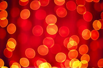 Abstract blurred bokeh lights on red background. Christmas and new year holidays light