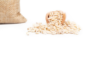 Studio lighting. Groats on a white background, close-up. Pearl barley. No isolation.