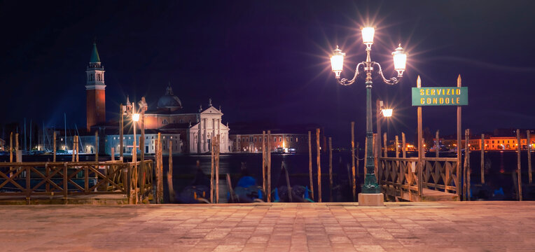 Church of San Giorgio Maggiore at night with the gondole closed due to the coivid-19