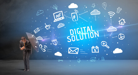 Businessman defending with umbrella from DIGITAL SOLUTION inscription, modern technology concept