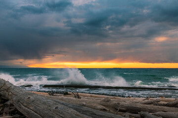 Waves splashing at Whidbey Island beach during sunset