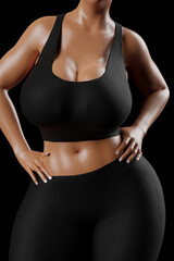 Fototapeta premium Young slim woman with big breasts in black sportswear