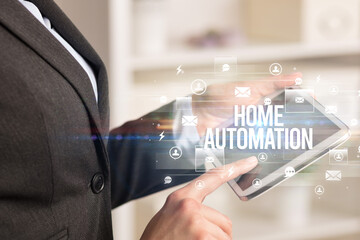 Close-up of a tablet searching HOME AUTOMATION inscription, modern technology concept