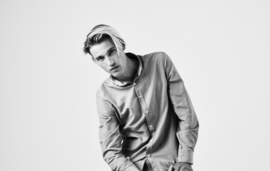 Romantic man in shirt gesturing with hands black and white photography light background cropped view