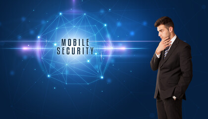 Businessman thinking about security solutions with MOBILE SECURITY inscription
