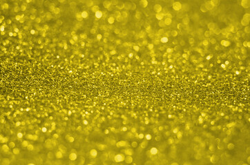 Illuminating Pantone Color Of The Year 2021. Abstract festive bokeh background with shining defocus sparkles. Blurred glitters shimmering dust macro close up, copy space for text logo