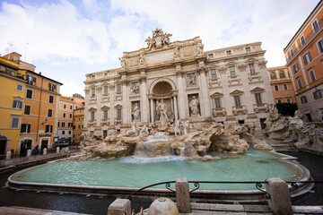 Fototapeta na wymiar Trevi Fountain, Fontana di Trevi in ​​Rome. The Trevi Fountain is the largest Baroque fountain, it is one of the most famous symbols of Rome. Rare shots in the period of the lockdown empty square.