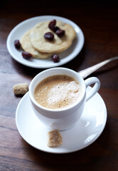 Cup of coffee on rustic wooden background. Close up. 