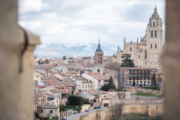 views from a castle. Snowy mountain in the background of the landscape. Height view, rooftops