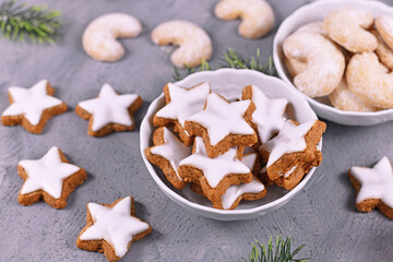 Bowl with traditional German cinnamon star Christmas cookies  called 'Zimtsterne' made with amonds, egg white, sugar, cinnamon and flour 