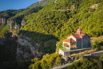 Fototapeta na wymiar Scenic Orthodox Monastery (Moni Agiou Ioannou Prodromou) built inside rocky mountain.