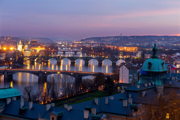 Fototapeta na wymiar Night Prague City with its Cathedrals, Towers and Bridges in the Christmas Time, Czech Republic