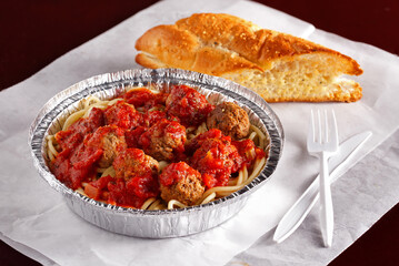 Carry-out spaghetti and meatballs with fresh bread