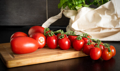 tomatoes and basil on a board
