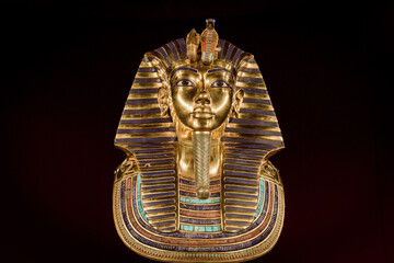 Replica of the funerary mask of Tutankhamun. Isolated on black background