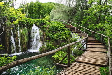 Obraz premium Plitvice Lakes beautiful nature, wood bridge. lakes, waterfall, rainbow, rivers.
