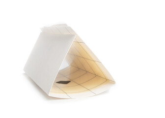 Pheromone moth trap isolated on white. An assembled unused trap for pantry or clothes moths. Adult...