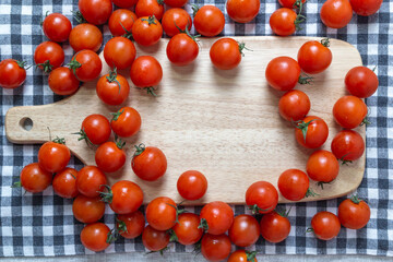 Cherry tomatoes on the table mat, top view
