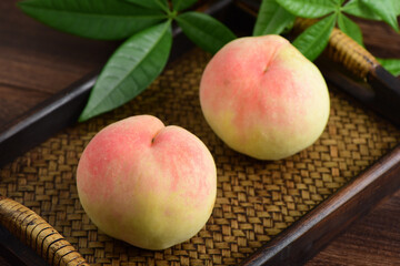 Fresh fruits and peaches on the background of retro Chinese style