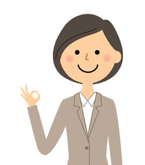 OKサインをするスーツの女性
