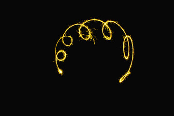 abstract curve gold yellow sparkler overlays texture elegant surface pattern on black.