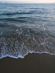 sea wave with foam on the beach