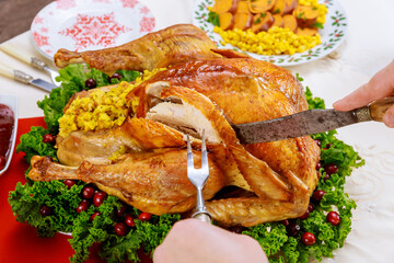Hand cut roasted whole turkey for Christmas dinner.