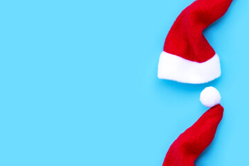 Santa hats on blue background.