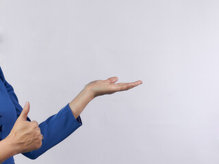A woman's hand shows a like, thumbs up, on a light background. There is space.