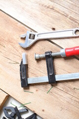 carpenter's tools lie on a wooden table clamp plane