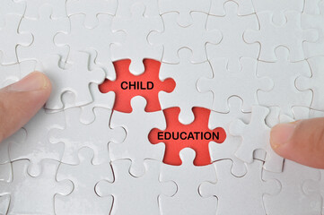 The words CHILD and EDUCATION in missing piece jigsaw puzzle. Education concept. 