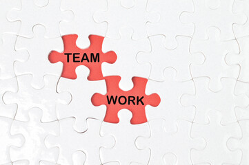 The Words Team And Work In Missing Piece Jigsaw Puzzle. Business concept. 