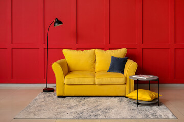 Stylish interior of room with cozy sofa