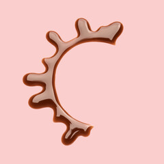 Spilled liquid chocolate on color background