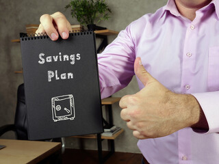 Financial concept meaning Savings Plan 2 with inscription on the piece of paper.