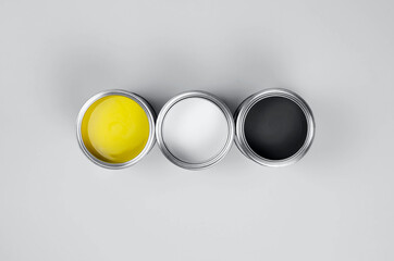 Cans of paint in trendy color combinations.