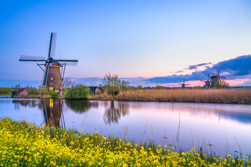 Dutch windmill at sunset in Kinderdijk. Netherlands 