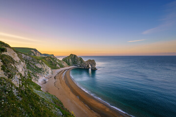 Durdle Door at sunrise in Dorset, Jurassic Coast, England, UK