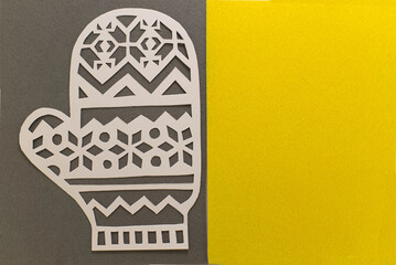 Paper cut glove on grey yellow background