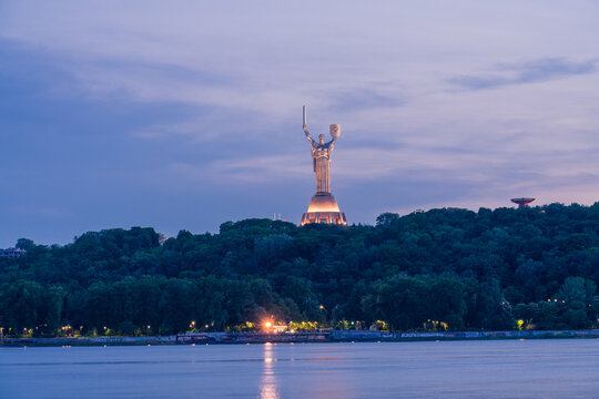 Kiev / Ukraine - May 2019: The famous Motherland Monument also known as Rodina-Mat' at dusk