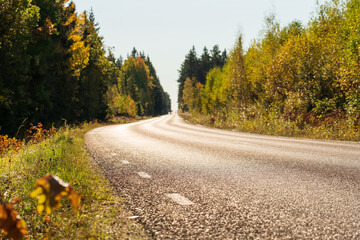Road in autumn - focus on asphalt 